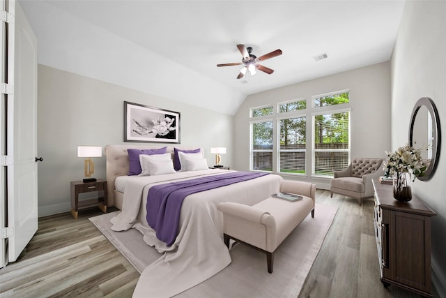 23414 Fauburg Dr, New Caney, TX 77357 - bedroom featuring light wood-type flooring, vaulted ceiling, and ceiling fan