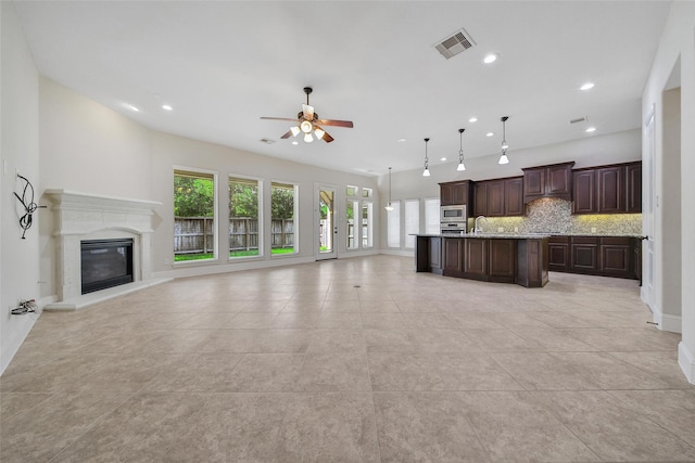 23414 Fauburg Dr, New Caney, TX 77357 - unfurnished living room with a ceiling fan, light tile patterned floors, recessed lighting, and a fireplace
