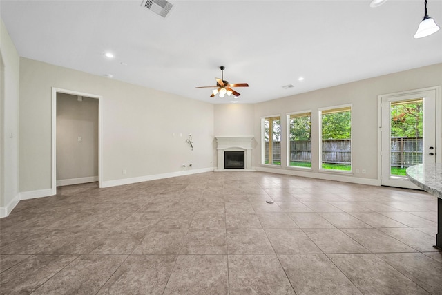 23414 Fauburg Dr, New Caney, TX 77357 - unfurnished living room with a glass covered fireplace, ceiling fan, recessed lighting, and light tile patterned floors