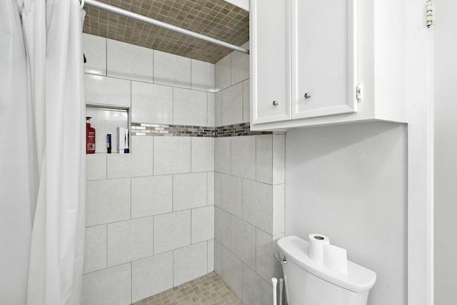 15110 Runbell Pl, Houston, TX 77095 - bathroom featuring toilet and a tile shower