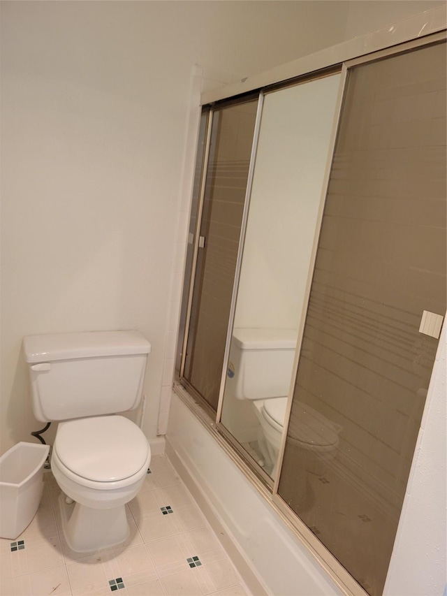 5801 Lumberdale Rd Unit 226, Houston, TX 77092 - bathroom with tile patterned floors and shower / bath combination with glass door