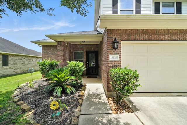 18123 Hillock Glen Ln, Cypress, TX 77429 - view of exterior entry with brick siding and a garage