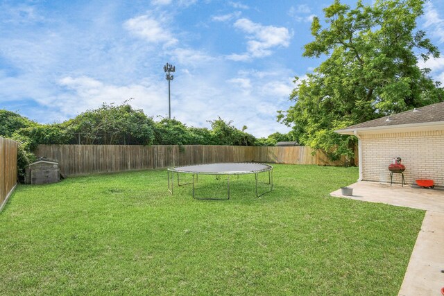 6814 Della St, Houston, TX 77093 - fenced backyard with a trampoline and a patio area