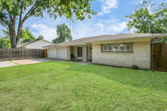 6814 Della St, Houston, TX 77093 - ranch-style house with an attached garage, driveway, and brick siding