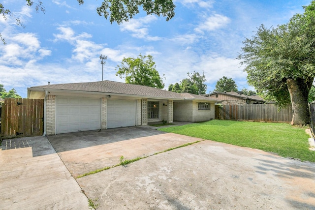 6814 Della St, Houston, TX 77093 - ranch-style home featuring concrete driveway, an attached garage, and brick siding