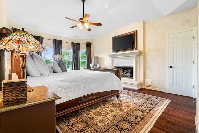 1734 Forestlake Dr, Sugar Land, TX 77479 - bedroom with vaulted ceiling, wood finished floors, and a fireplace with raised hearth