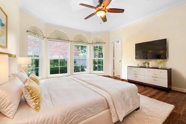 1734 Forestlake Dr, Sugar Land, TX 77479 - bedroom featuring crown molding, dark wood-type flooring, and a ceiling fan