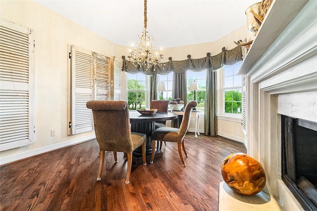 1734 Forestlake Dr, Sugar Land, TX 77479 - dining area with a chandelier, dark wood finished floors, plenty of natural light, and a premium fireplace