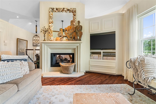 1734 Forestlake Dr, Sugar Land, TX 77479 - living area featuring dark wood finished floors, recessed lighting, and a glass covered fireplace