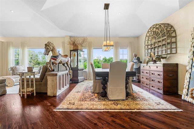 1734 Forestlake Dr, Sugar Land, TX 77479 - dining room featuring plenty of natural light, dark wood-style flooring, lofted ceiling, and a chandelier