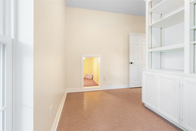 1734 Forestlake Dr, Sugar Land, TX 77479 - hallway featuring baseboards and light carpet