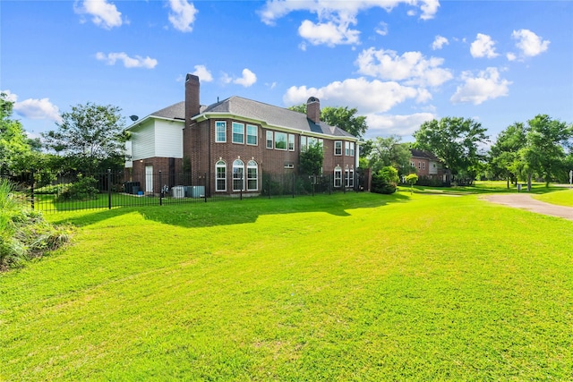 1734 Forestlake Dr, Sugar Land, TX 77479 - rear view of house with brick siding and a chimney