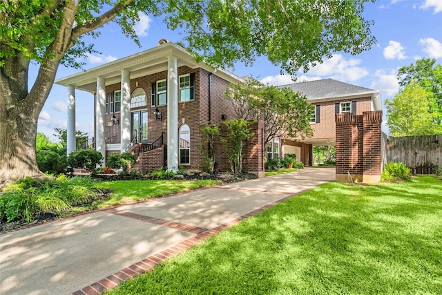1734 Forestlake Dr, Sugar Land, TX 77479 - view of front facade with brick siding, driveway, and stairway