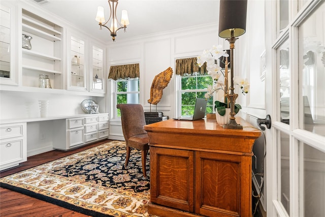 1734 Forestlake Dr, Sugar Land, TX 77479 - home office featuring a chandelier, crown molding, dark wood-style floors, and built in desk