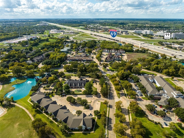 1734 Forestlake Dr, Sugar Land, TX 77479 - aerial perspective of suburban area featuring a large body of water and a tree filled landscape