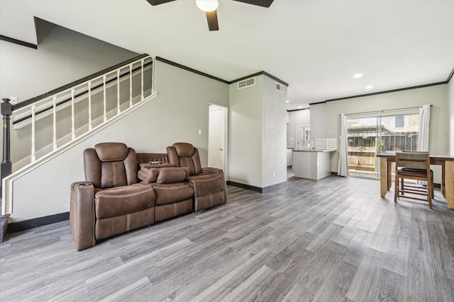 3600 Jeanetta St Unit 1902, Houston, TX 77063 - living area with wood finished floors, ceiling fan, stairs, ornamental molding, and recessed lighting