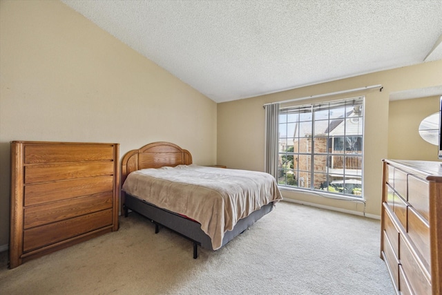 3600 Jeanetta St Unit 1902, Houston, TX 77063 - bedroom featuring light carpet, a textured ceiling, and lofted ceiling