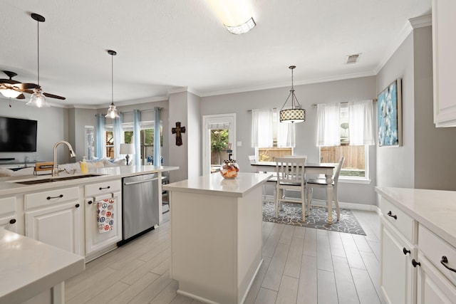 16403 Bogan Flats Ct, Houston, TX 77095 - kitchen with dishwasher, a center island, wood finish floors, a ceiling fan, and light countertops