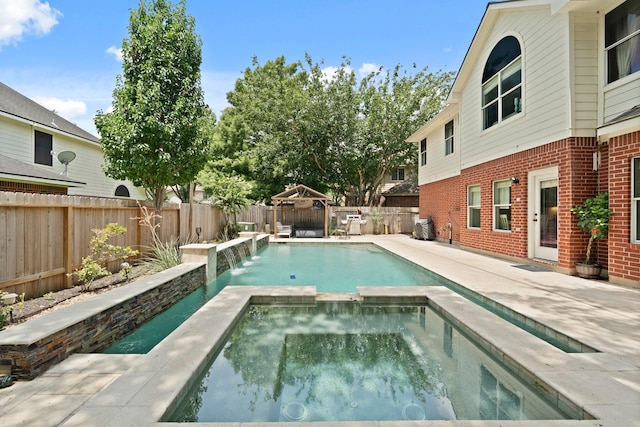16403 Bogan Flats Ct, Houston, TX 77095 - view of pool with a fenced backyard, a pool with connected hot tub, and a patio area