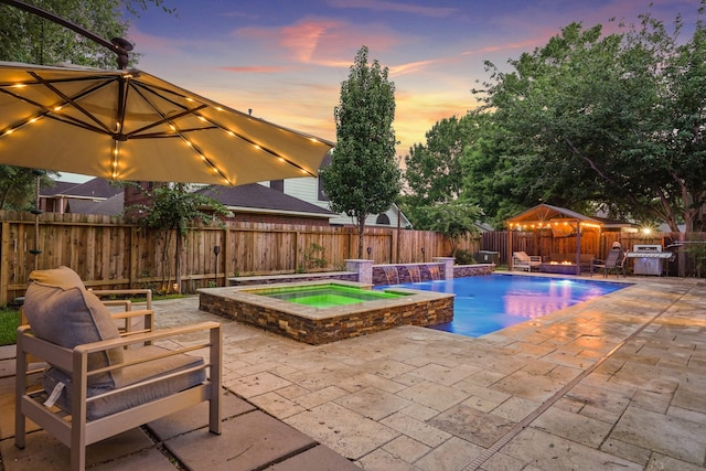 16403 Bogan Flats Ct, Houston, TX 77095 - view of swimming pool with a patio, a fenced backyard, a pool with connected hot tub, and a gazebo