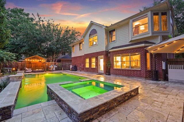 16403 Bogan Flats Ct, Houston, TX 77095 - view of pool featuring a fenced backyard, a patio, and a pool with connected hot tub
