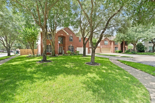 16403 Bogan Flats Ct, Houston, TX 77095 - view of front facade with driveway, an attached garage, a front yard, and brick siding