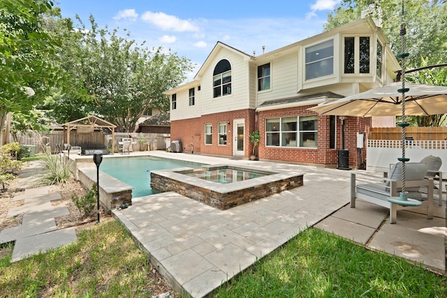 16403 Bogan Flats Ct, Houston, TX 77095 - view of swimming pool featuring an in-ground hot tub, a patio, and a fenced backyard
