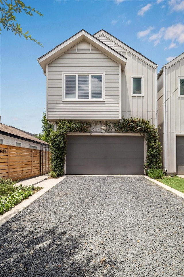 928 Robbie St Unit B, Houston, TX 77009 - view of front of property with driveway, a garage, and board and batten siding