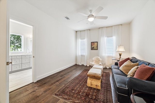 928 Robbie St Unit B, Houston, TX 77009 - living area featuring dark wood-style floors and ceiling fan