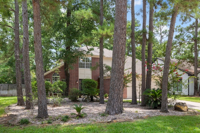 34 Sweetdream Pl, The Woodlands, TX 77381 - view of front facade featuring brick siding