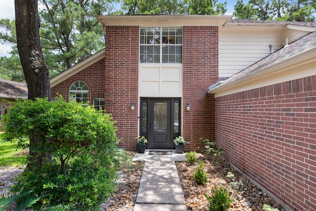 34 Sweetdream Pl, The Woodlands, TX 77381 - entrance to property featuring brick siding and a shingled roof