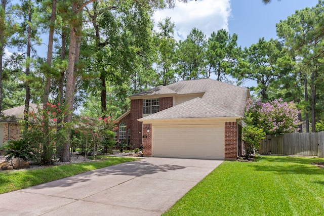 34 Sweetdream Pl, The Woodlands, TX 77381 - traditional home with an attached garage, roof with shingles, driveway, and brick siding