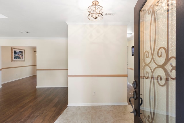 34 Sweetdream Pl, The Woodlands, TX 77381 - entryway featuring crown molding, a chandelier, and wood finished floors