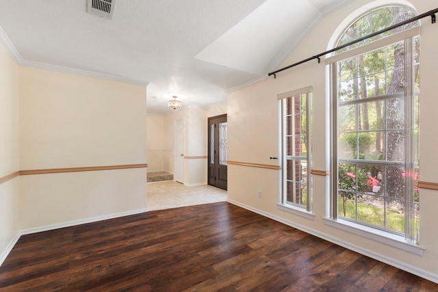 34 Sweetdream Pl, The Woodlands, TX 77381 - empty room featuring plenty of natural light, hardwood / wood-style flooring, ornamental molding, and lofted ceiling