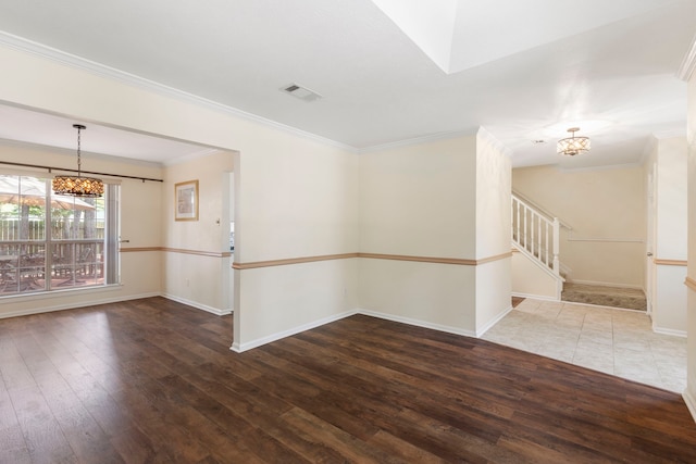 34 Sweetdream Pl, The Woodlands, TX 77381 - unfurnished room featuring a chandelier, hardwood / wood-style flooring, crown molding, and stairway