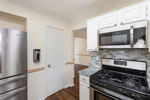 34 Sweetdream Pl, The Woodlands, TX 77381 - kitchen with appliances with stainless steel finishes, ornamental molding, dark wood-style flooring, and white cabinetry
