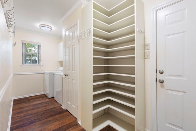 34 Sweetdream Pl, The Woodlands, TX 77381 - laundry area with cabinet space, dark wood-type flooring, ornamental molding, and washing machine and dryer
