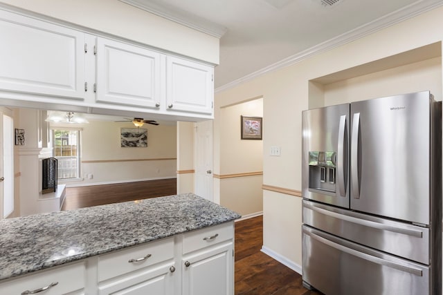 34 Sweetdream Pl, The Woodlands, TX 77381 - kitchen with stainless steel refrigerator with ice dispenser, crown molding, dark wood finished floors, light stone counters, and white cabinets