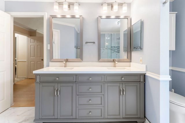 34 Sweetdream Pl, The Woodlands, TX 77381 - bathroom with double vanity, ornamental molding, and marble finish flooring