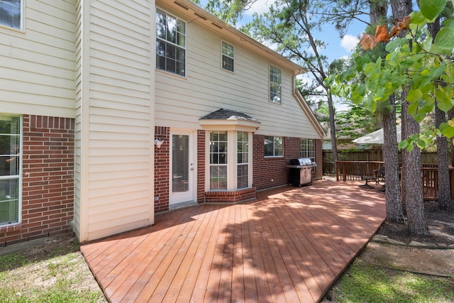 34 Sweetdream Pl, The Woodlands, TX 77381 - wooden deck with a grill