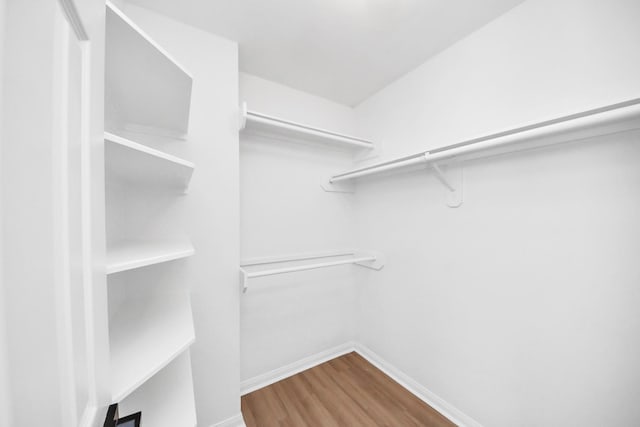 7407 Rustic Chase Dr, Richmond, TX 77407 - walk in closet featuring wood finished floors