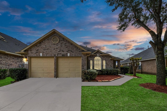 7407 Rustic Chase Dr, Richmond, TX 77407 - single story home featuring a garage, concrete driveway, brick siding, and a yard