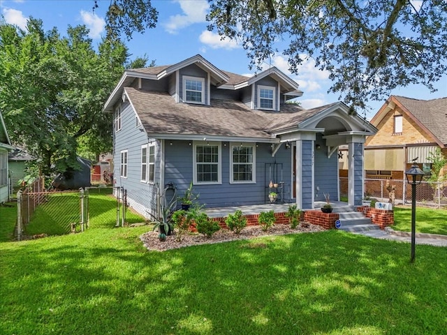 3217 Michigan St, Baytown, TX 77520 - view of front of home featuring a gate, a shingled roof, and covered porch