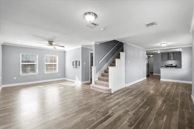3217 Michigan St, Baytown, TX 77520 - unfurnished living room with a ceiling fan, crown molding, stairway, and dark wood finished floors
