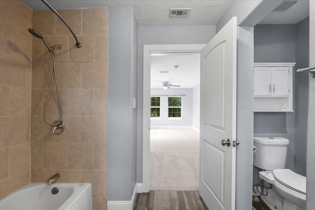3217 Michigan St, Baytown, TX 77520 - bathroom with bathing tub / shower combination, ceiling fan, and wood finished floors