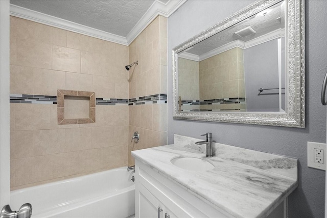 3217 Michigan St, Baytown, TX 77520 - bathroom featuring a textured ceiling, vanity, crown molding, and bathing tub / shower combination