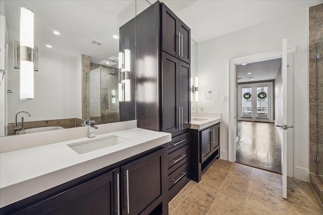 4410 Floyd St Unit B, Houston, TX 77007 - full bath featuring a shower stall, vanity, recessed lighting, a tub, and stone finish flooring