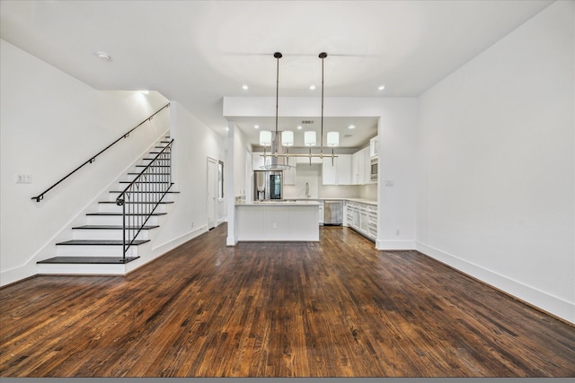 4410 Floyd St Unit B, Houston, TX 77007 - unfurnished living room featuring dark wood-style flooring, recessed lighting, and stairs