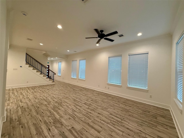 6635 Tc Jester Blvd Unit A, Houston, TX 77007 - unfurnished living room with wood finished floors, stairway, a ceiling fan, and recessed lighting