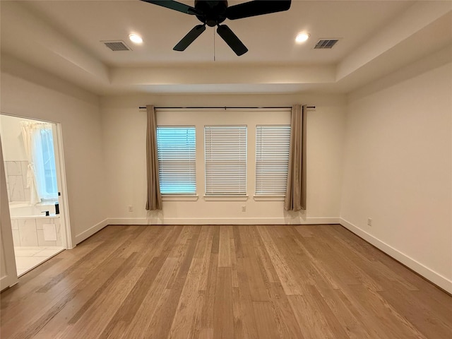 6635 Tc Jester Blvd Unit A, Houston, TX 77007 - spare room with a tray ceiling, wood finished floors, a ceiling fan, and recessed lighting